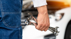 Person holding spanners